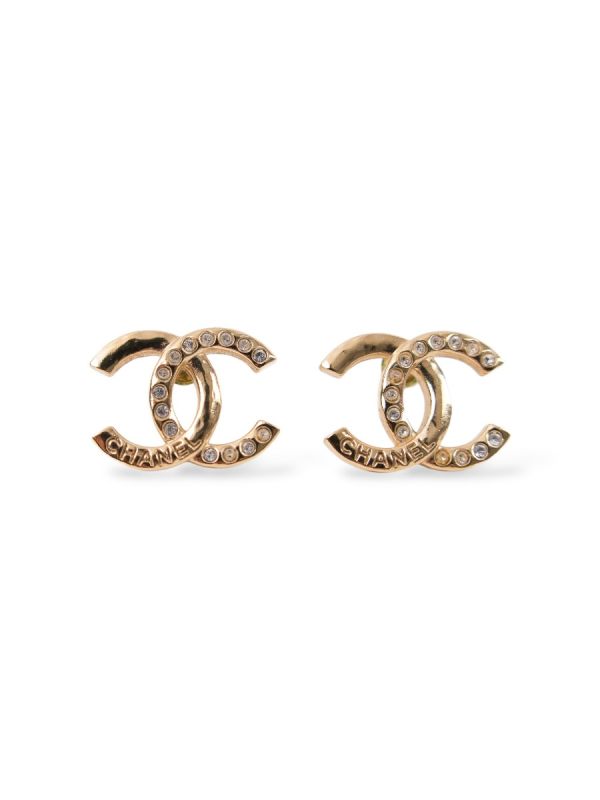 Boucles D'Oreilles Chanel Torsadées Dorées Avec Ecriture 